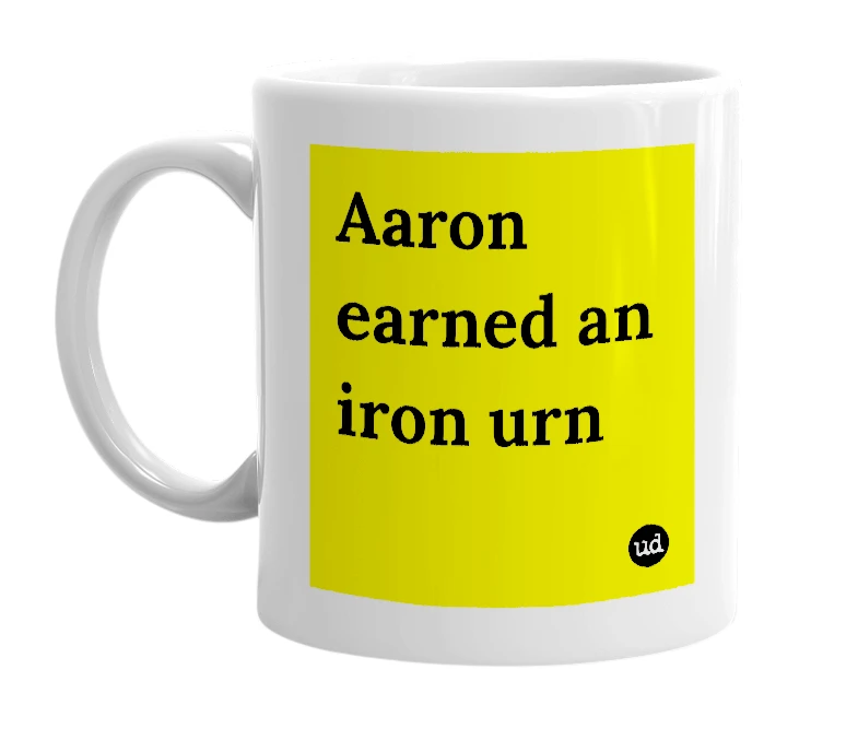 White mug with 'Aaron earned an iron urn' in bold black letters