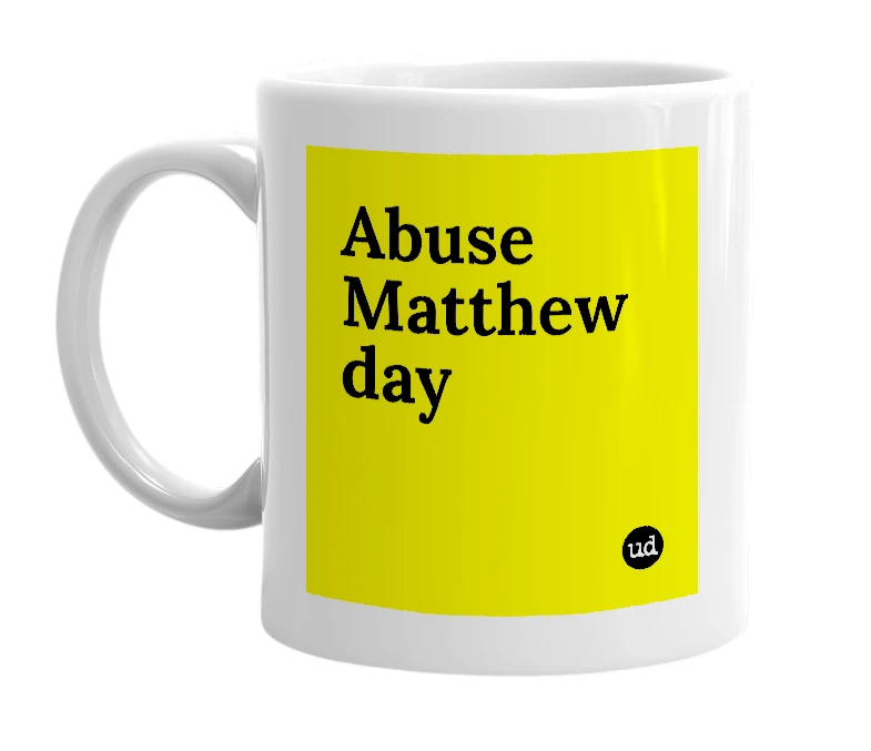 White mug with 'Abuse Matthew day' in bold black letters