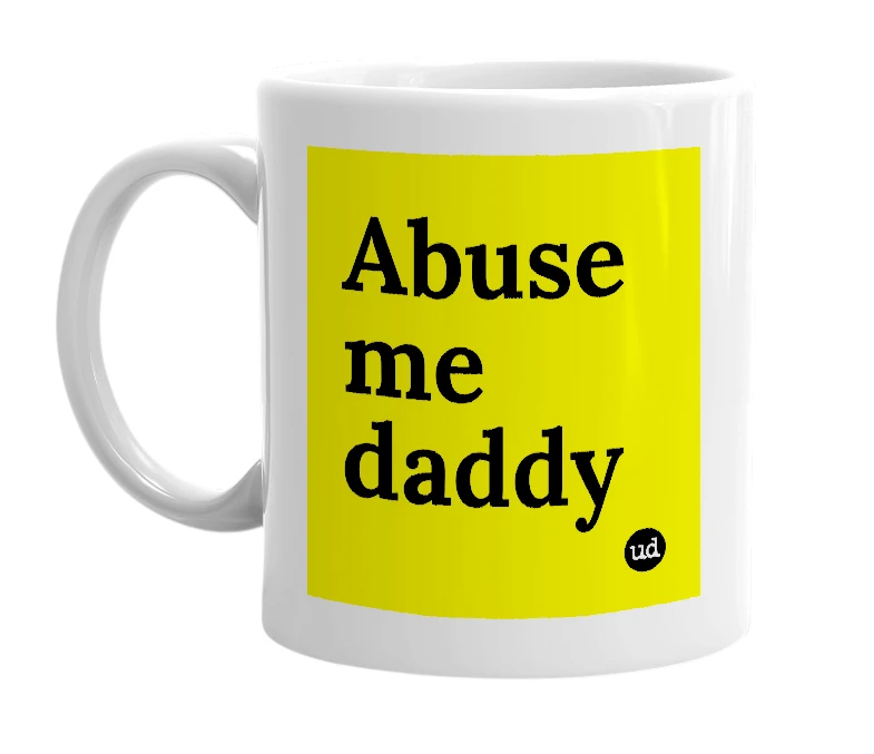 White mug with 'Abuse me daddy' in bold black letters