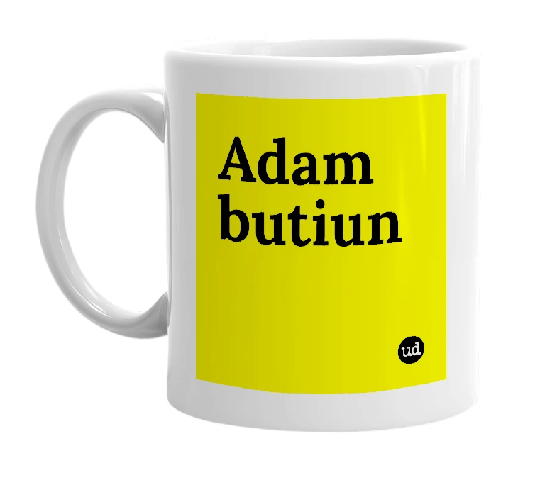White mug with 'Adam butiun' in bold black letters