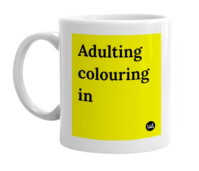 White mug with 'Adulting colouring in' in bold black letters