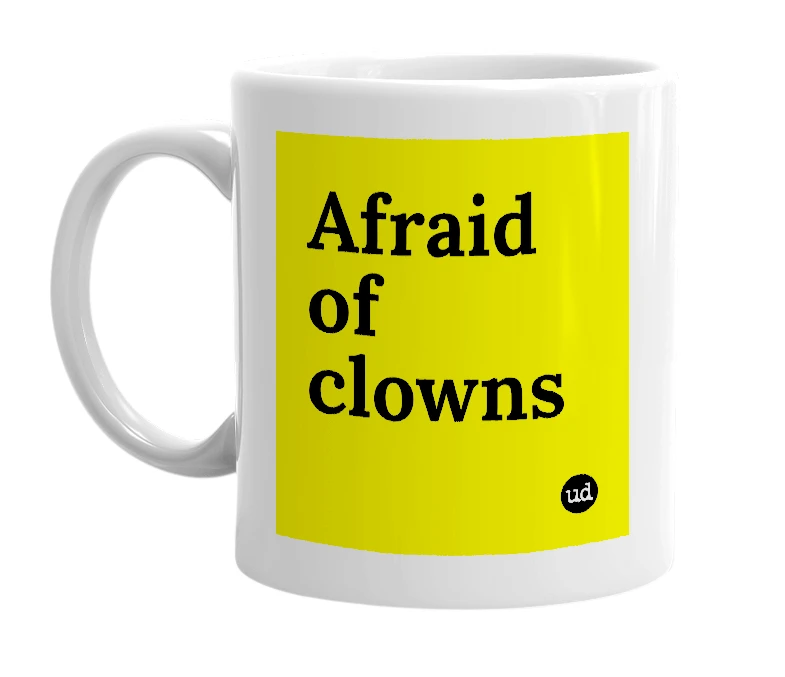 White mug with 'Afraid of clowns' in bold black letters