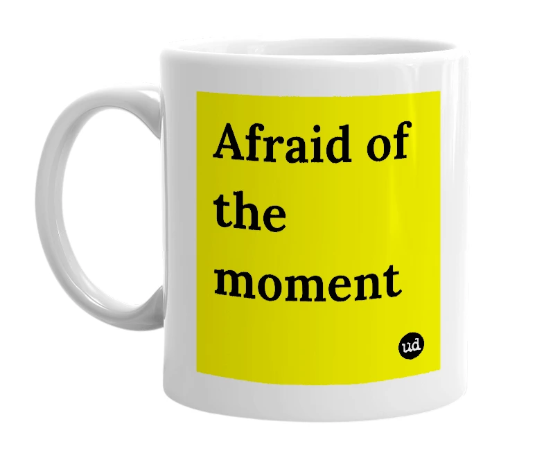 White mug with 'Afraid of the moment' in bold black letters