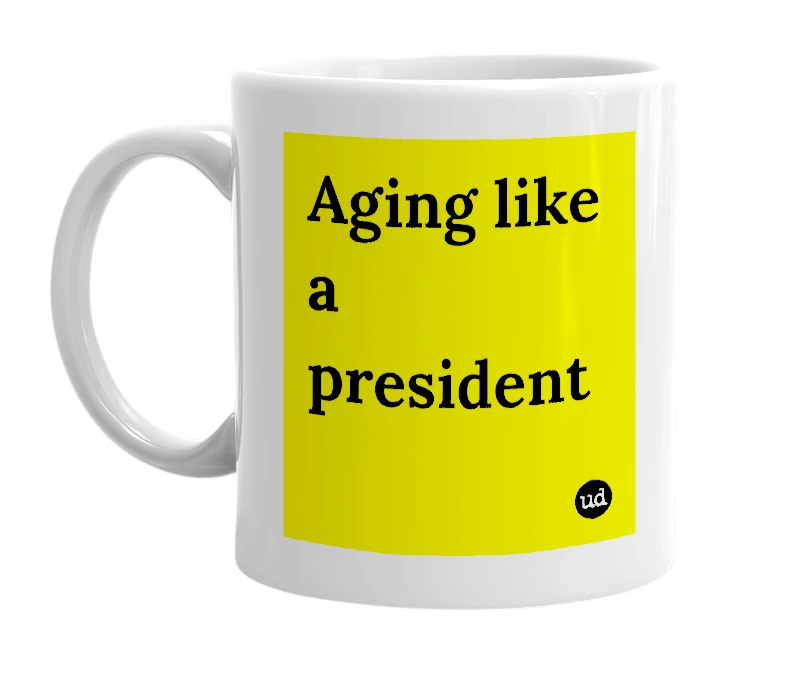 White mug with 'Aging like a president' in bold black letters