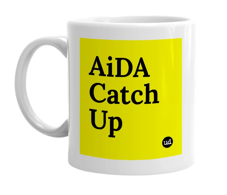 White mug with 'AiDA Catch Up' in bold black letters