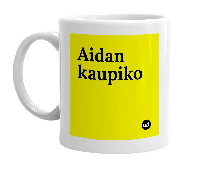 White mug with 'Aidan kaupiko' in bold black letters
