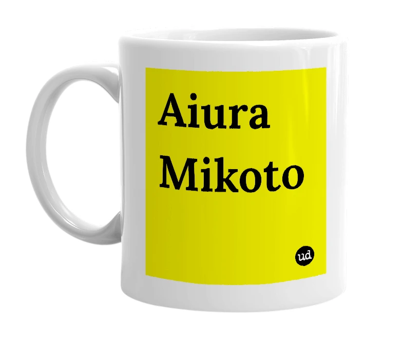 White mug with 'Aiura Mikoto' in bold black letters