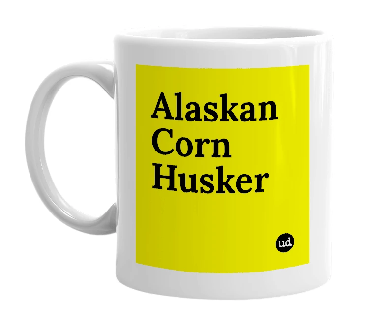 White mug with 'Alaskan Corn Husker' in bold black letters