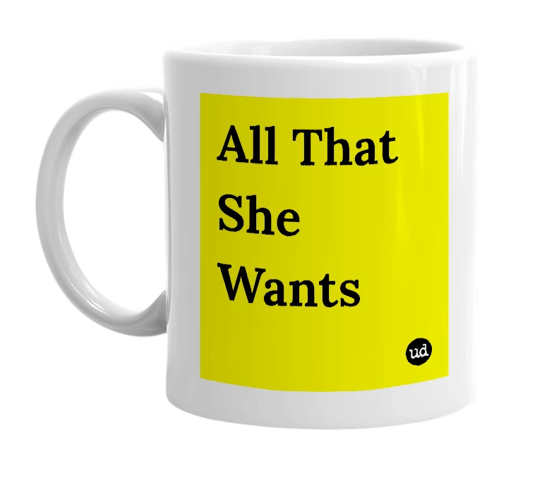 White mug with 'All That She Wants' in bold black letters