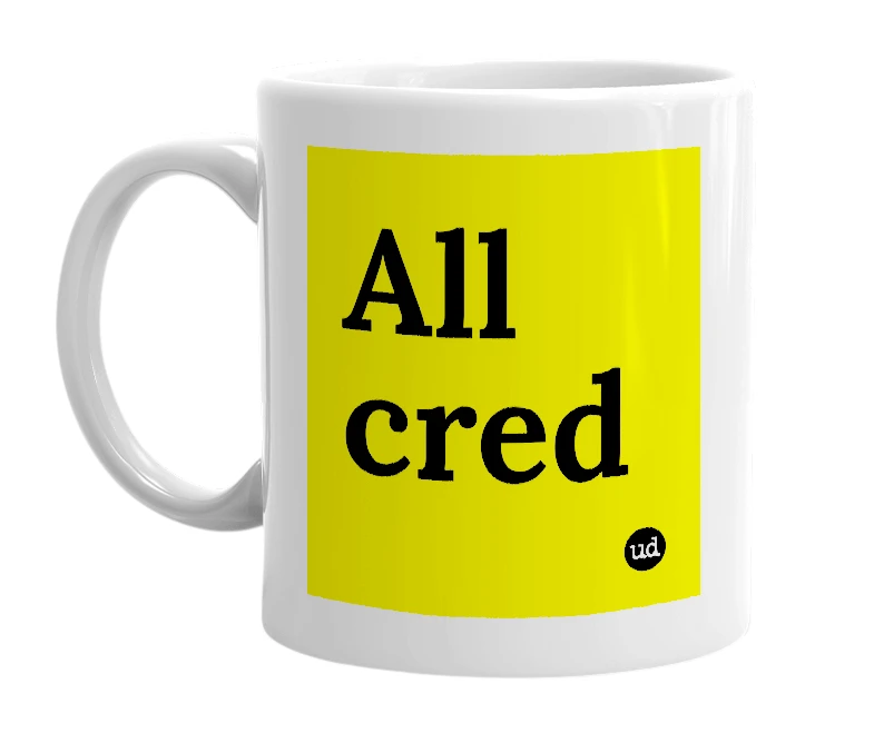 White mug with 'All cred' in bold black letters