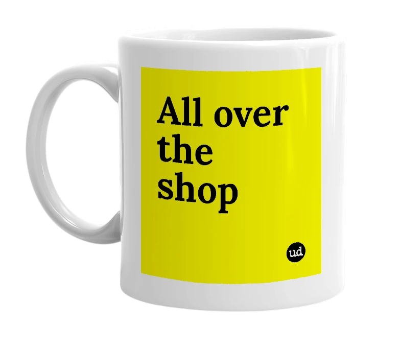 White mug with 'All over the shop' in bold black letters