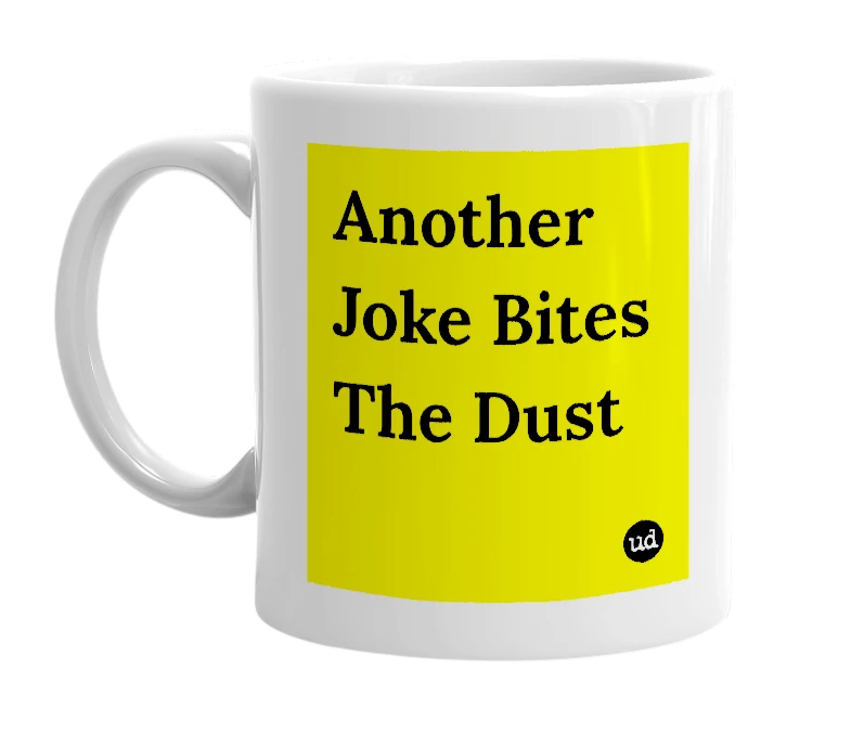 White mug with 'Another Joke Bites The Dust' in bold black letters