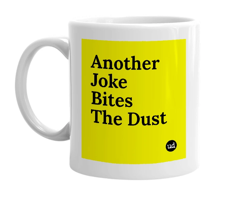 White mug with 'Another Joke Bites The Dust' in bold black letters