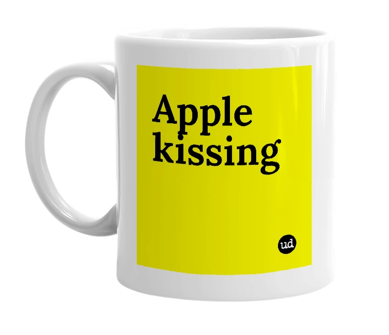 White mug with 'Apple kissing' in bold black letters