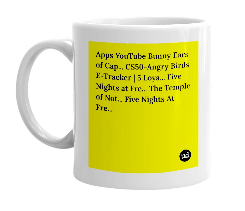 White mug with 'Apps YouTube Bunny Ears of Cap... CS50-Angry Birds E-Tracker | 5 Loya... Five Nights at Fre... The Temple of Not... Five Nights At Fre...' in bold black letters