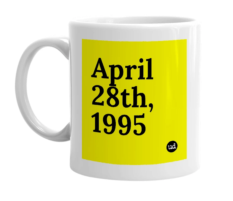 White mug with 'April 28th, 1995' in bold black letters
