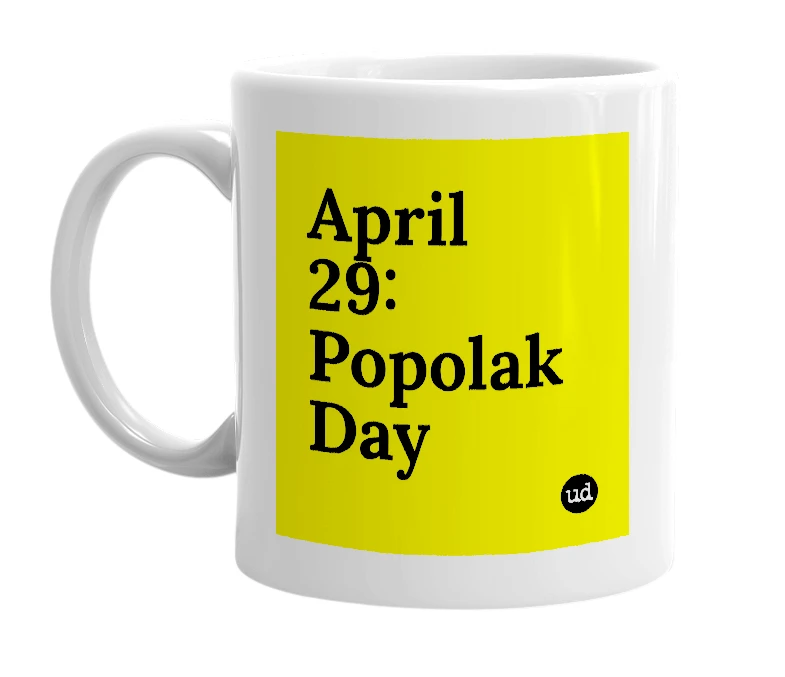 White mug with 'April 29: Popolak Day' in bold black letters