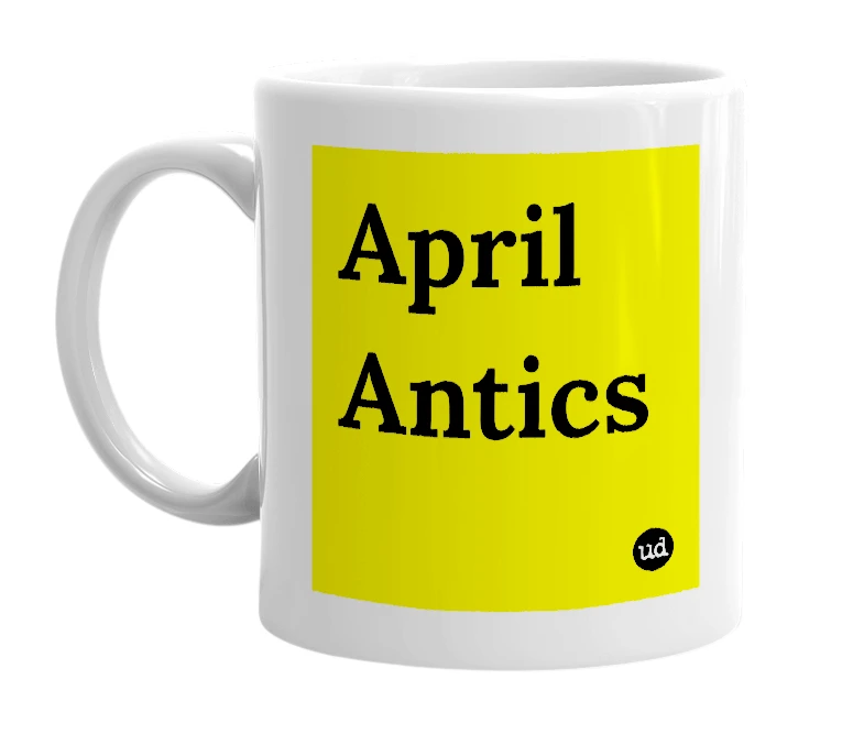 White mug with 'April Antics' in bold black letters