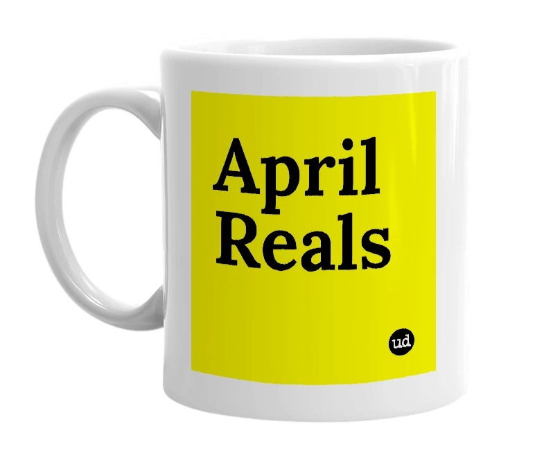 White mug with 'April Reals' in bold black letters