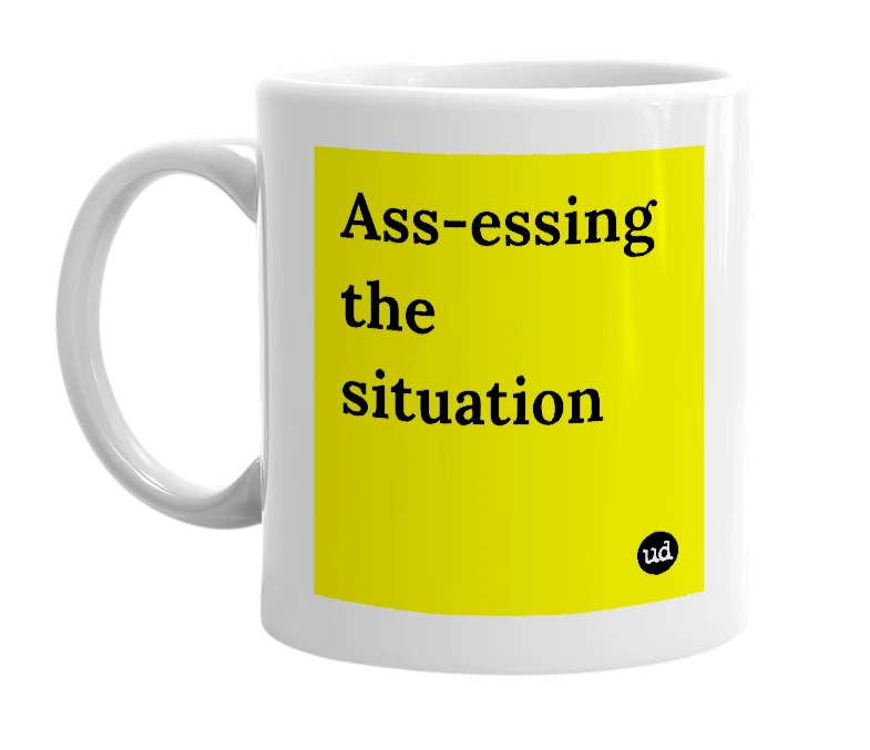 White mug with 'Ass-essing the situation' in bold black letters