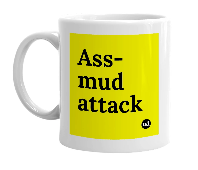 White mug with 'Ass-mud attack' in bold black letters