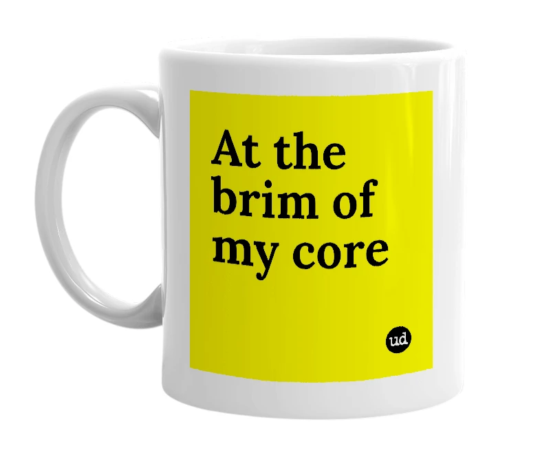 White mug with 'At the brim of my core' in bold black letters