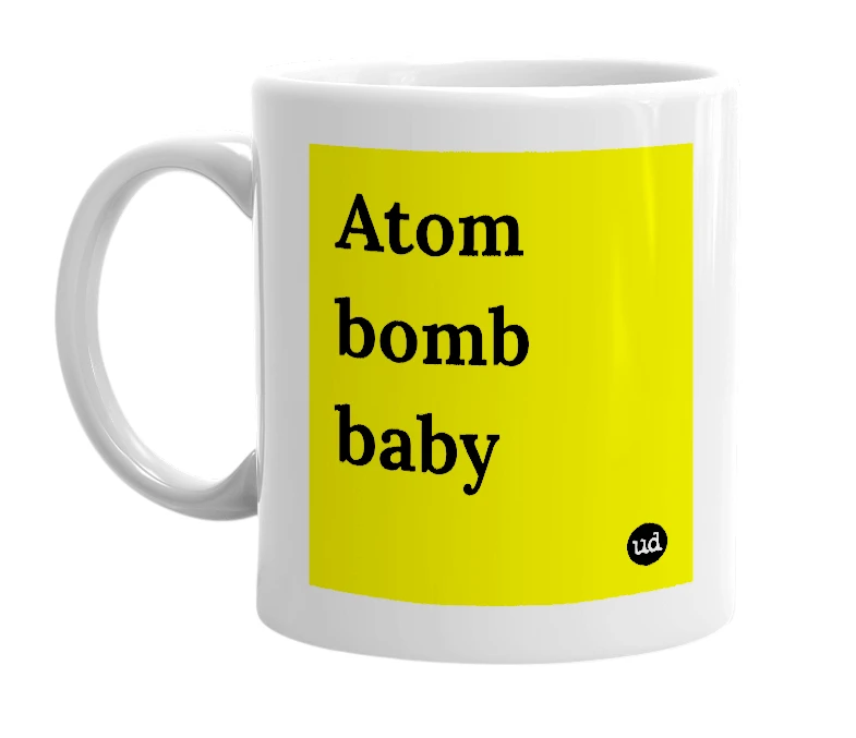 White mug with 'Atom bomb baby' in bold black letters