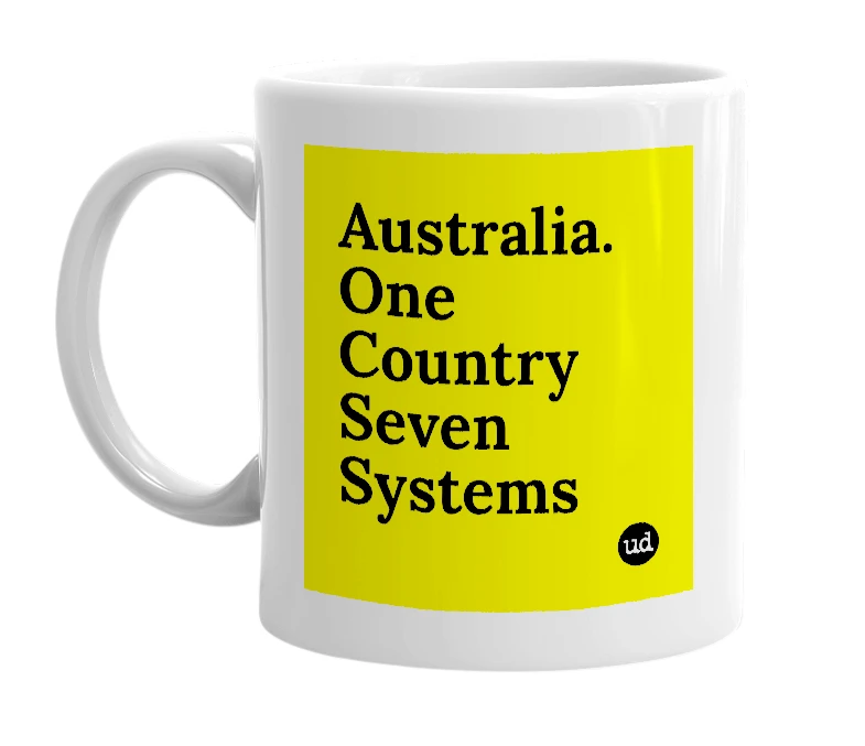 White mug with 'Australia. One Country Seven Systems' in bold black letters