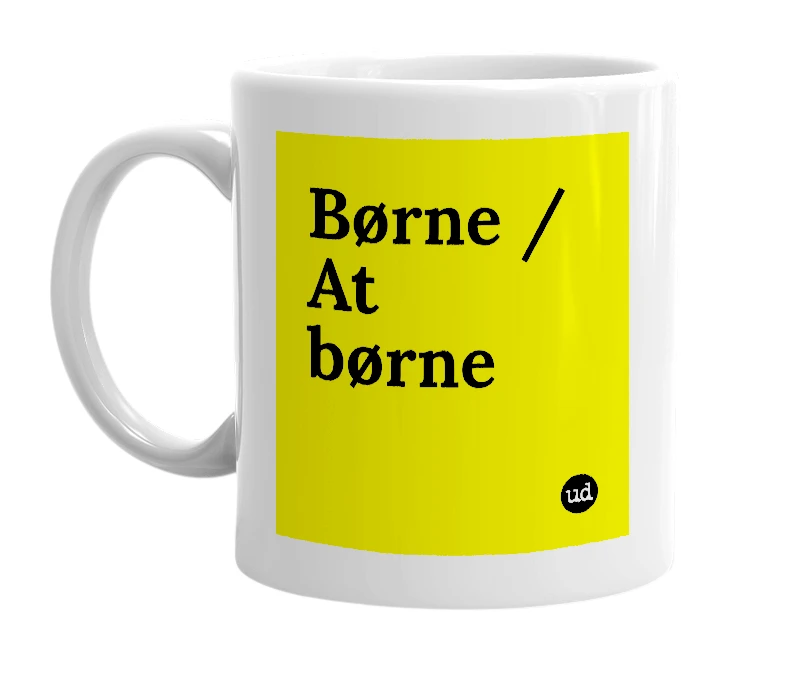 White mug with 'Børne / At børne' in bold black letters
