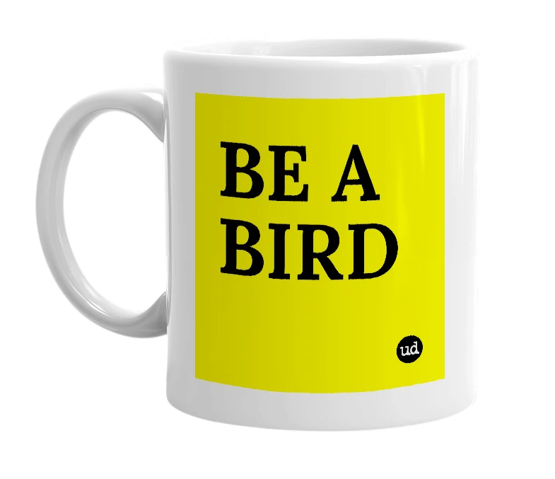 White mug with 'BE A BIRD' in bold black letters