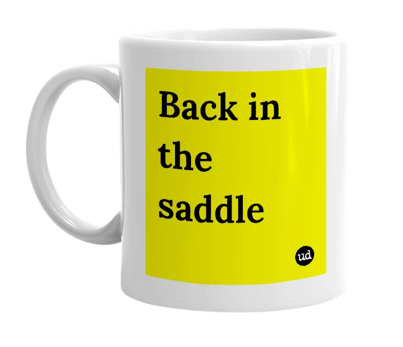 White mug with 'Back in the saddle' in bold black letters