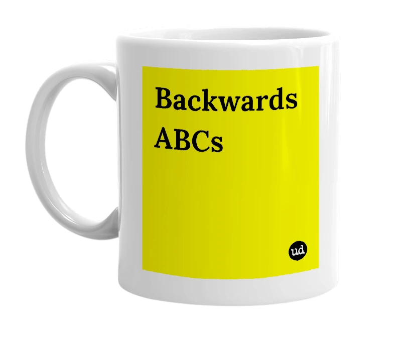 White mug with 'Backwards ABCs' in bold black letters