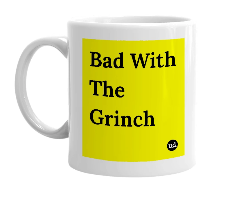 White mug with 'Bad With The Grinch' in bold black letters
