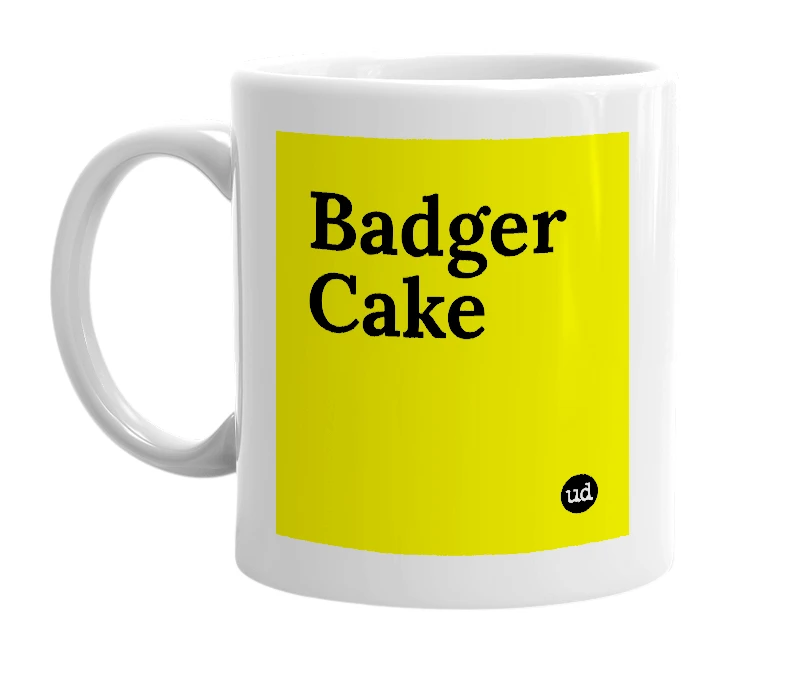 White mug with 'Badger Cake' in bold black letters