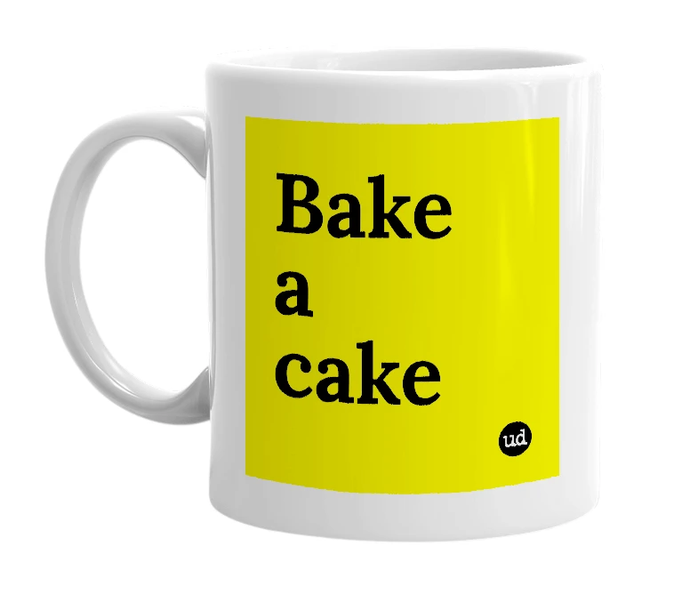 White mug with 'Bake a cake' in bold black letters