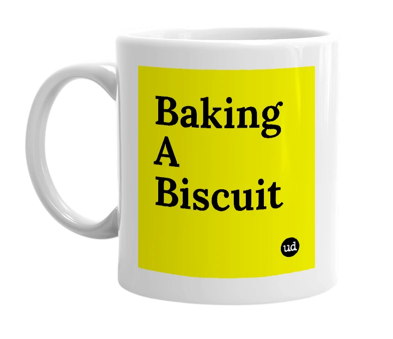 White mug with 'Baking A Biscuit' in bold black letters