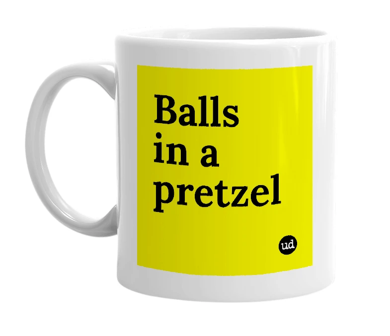 White mug with 'Balls in a pretzel' in bold black letters