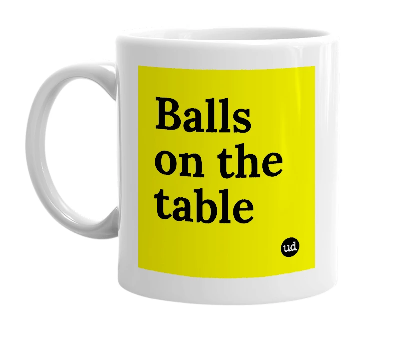 White mug with 'Balls on the table' in bold black letters