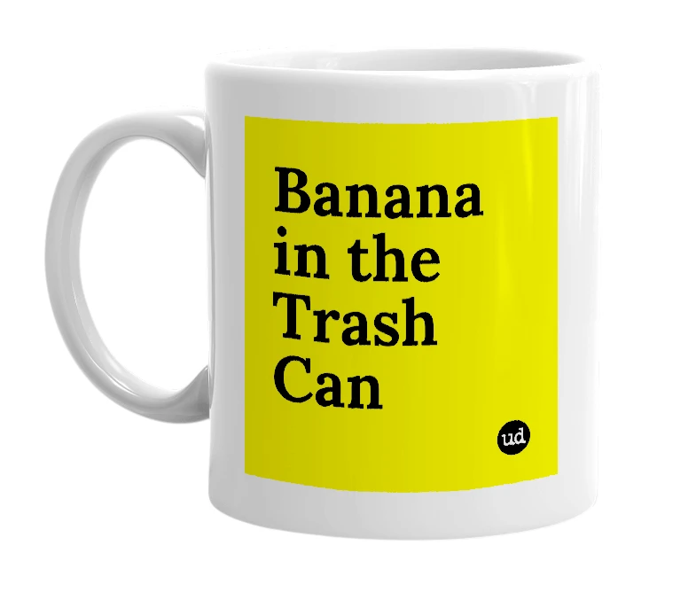 White mug with 'Banana in the Trash Can' in bold black letters