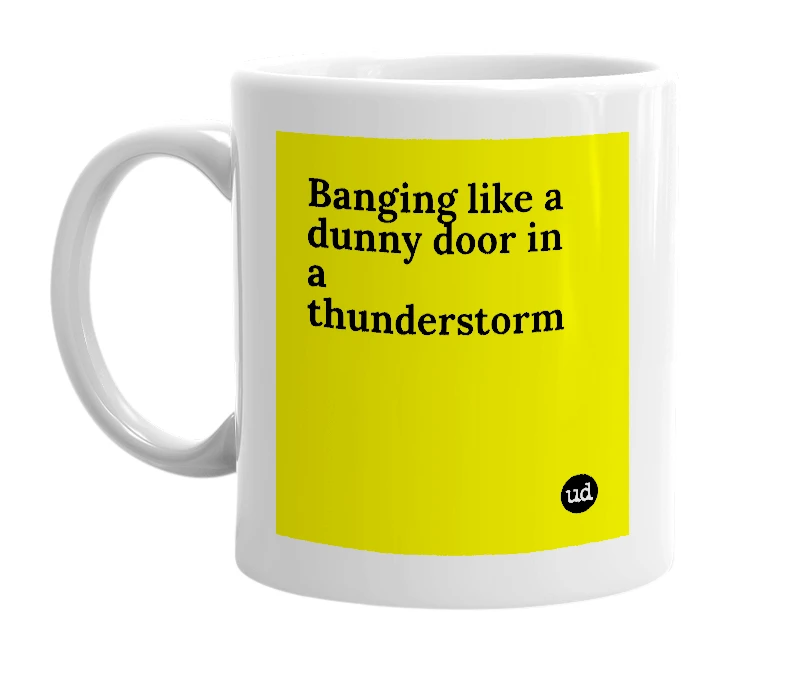 White mug with 'Banging like a dunny door in a thunderstorm' in bold black letters