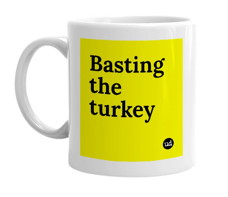 White mug with 'Basting the turkey' in bold black letters