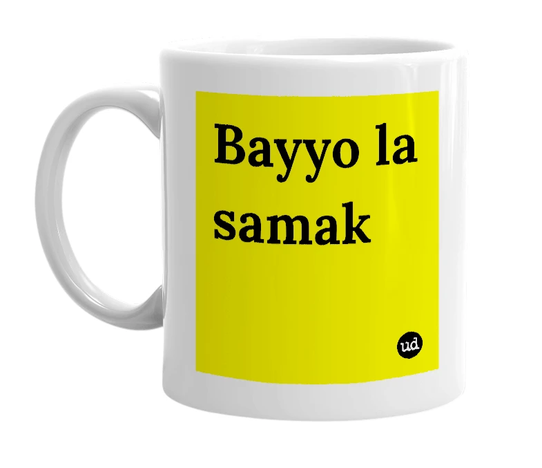 White mug with 'Bayyo la samak' in bold black letters