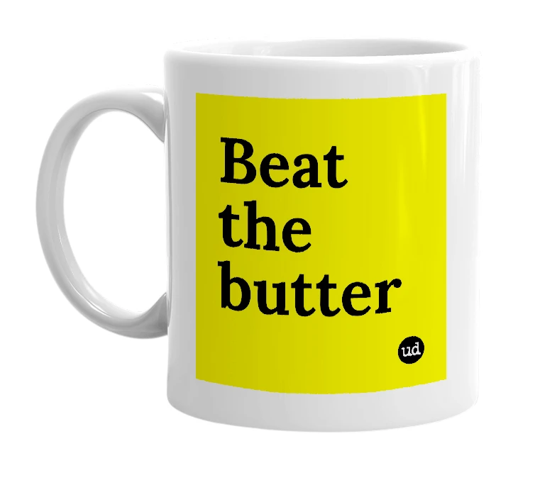 White mug with 'Beat the butter' in bold black letters