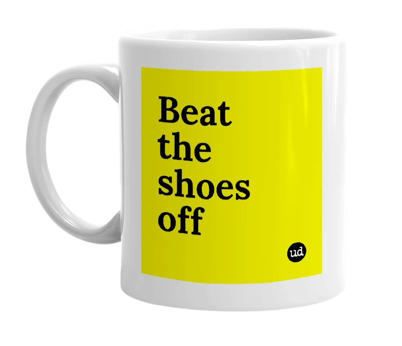 White mug with 'Beat the shoes off' in bold black letters