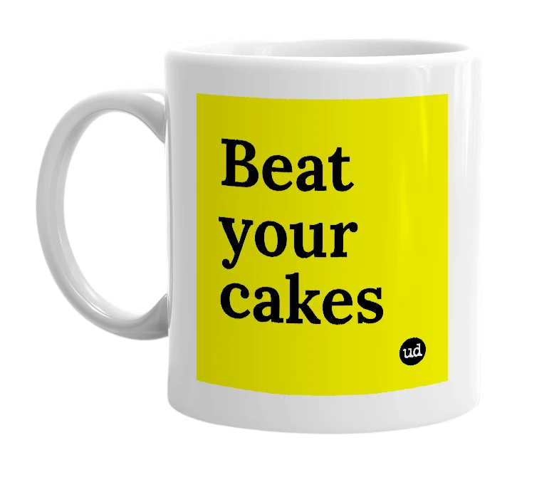 White mug with 'Beat your cakes' in bold black letters