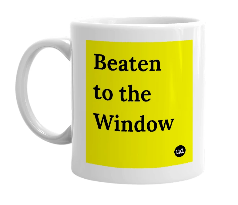 White mug with 'Beaten to the Window' in bold black letters
