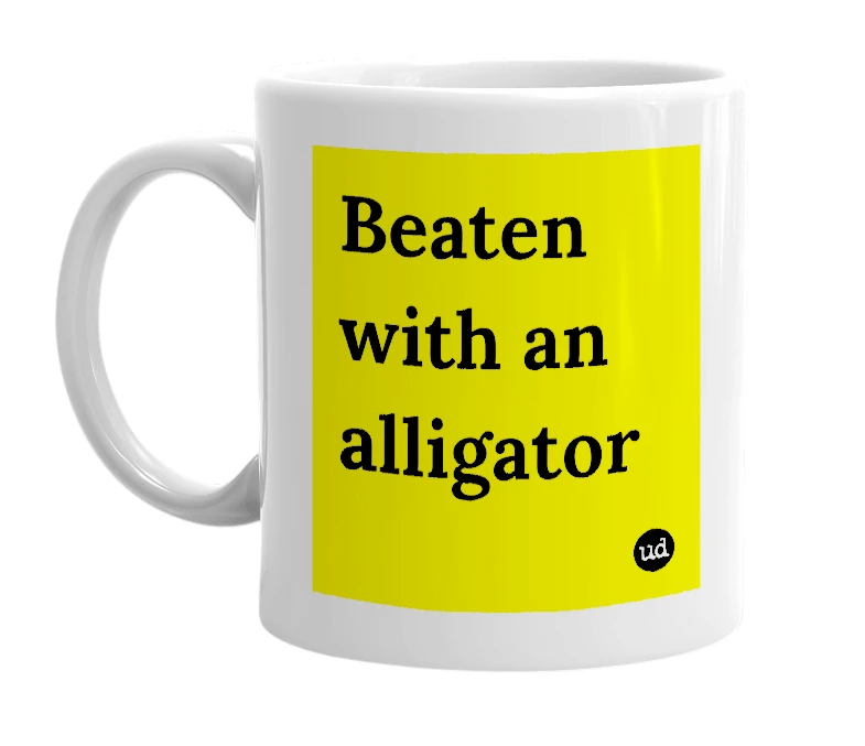 White mug with 'Beaten with an alligator' in bold black letters
