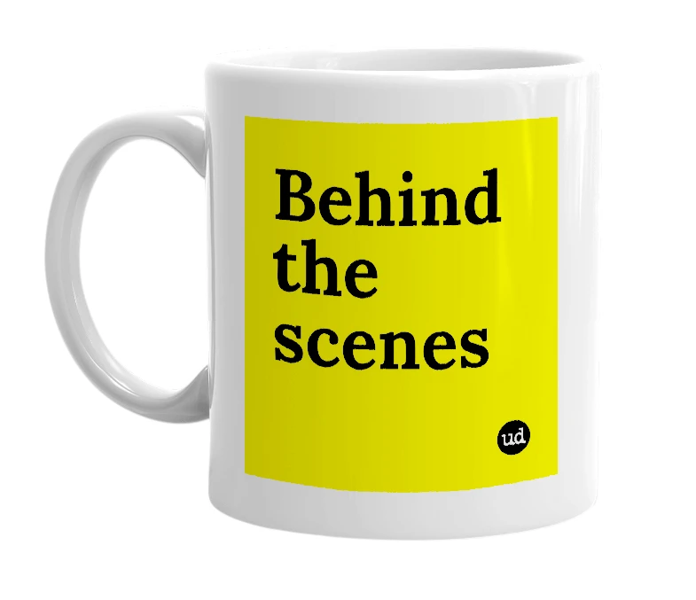 White mug with 'Behind the scenes' in bold black letters