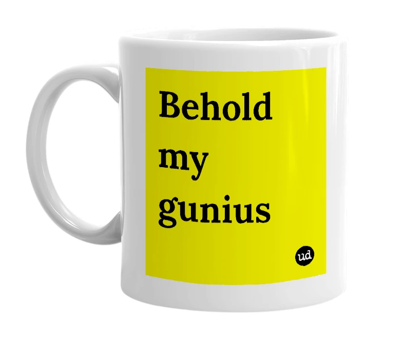 White mug with 'Behold my gunius' in bold black letters
