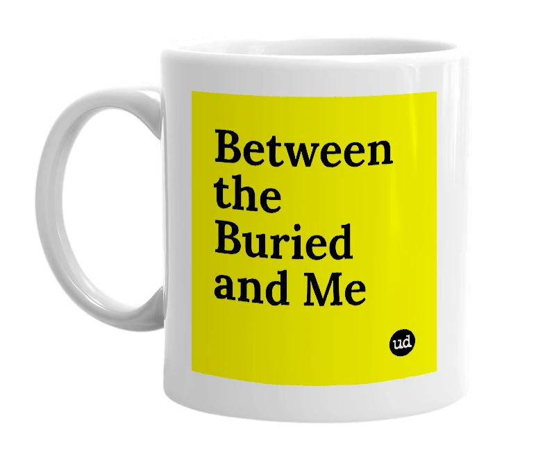 White mug with 'Between the Buried and Me' in bold black letters